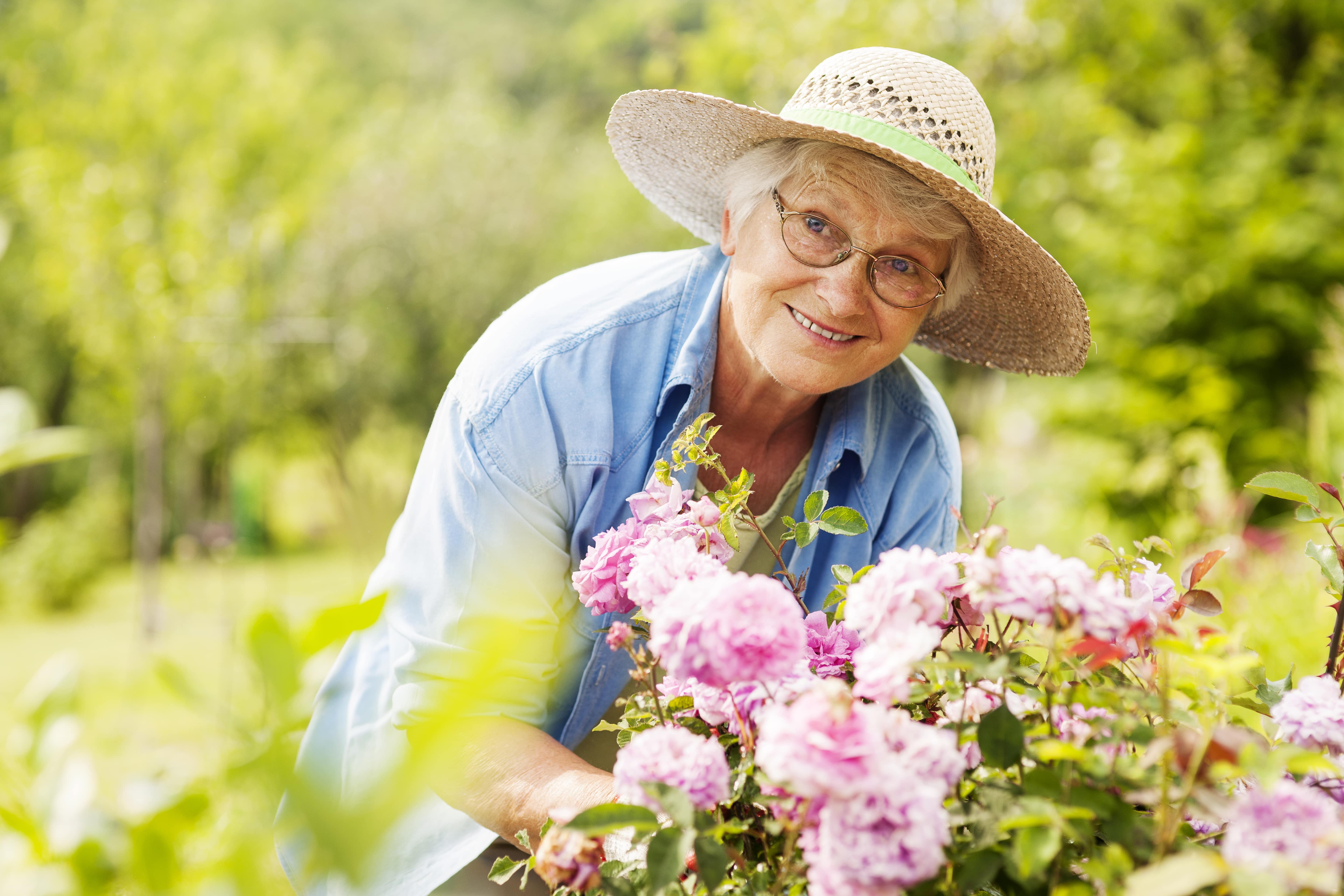 An older adult enjoying time in the garden
