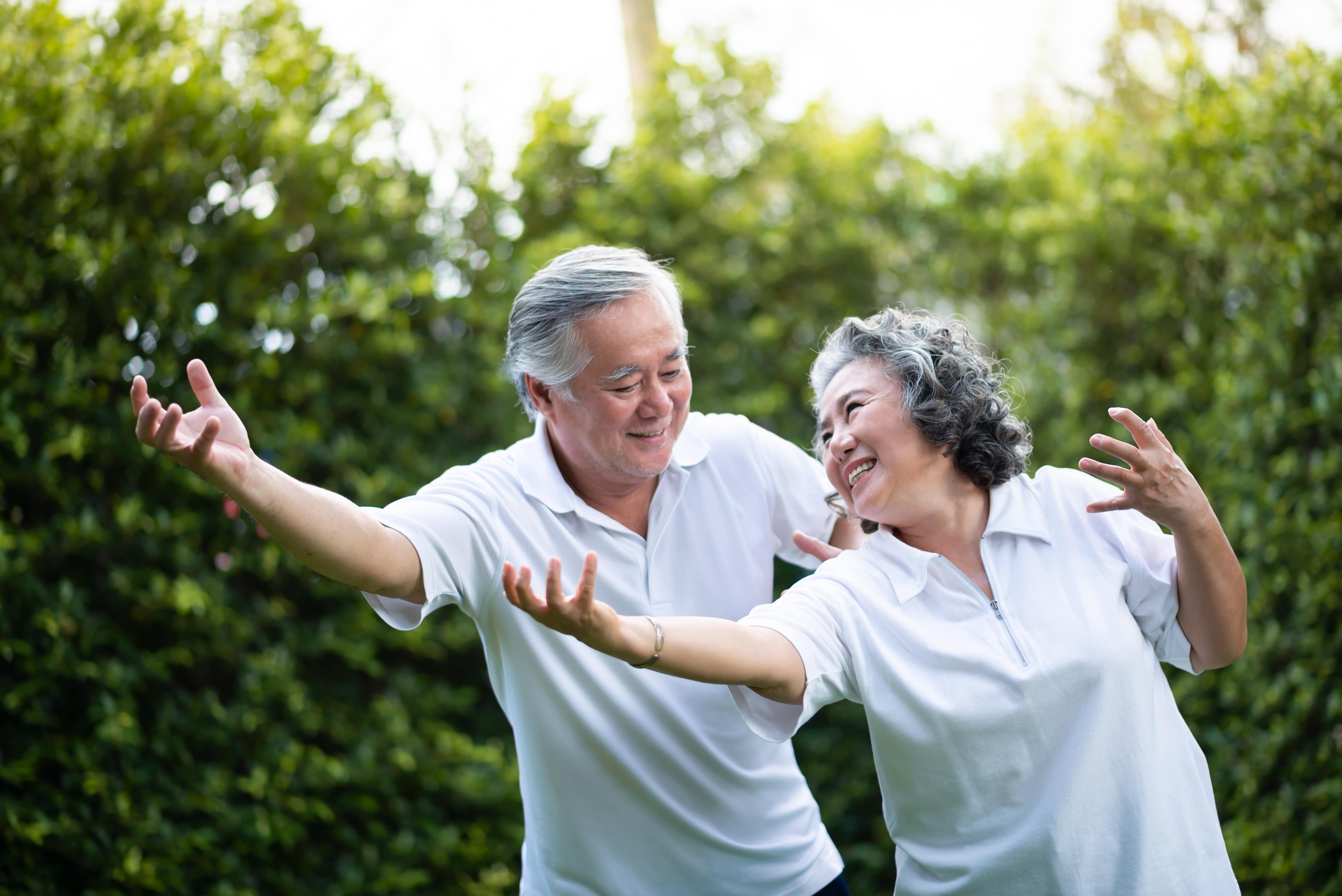 An older couple doing Tai Chi together
